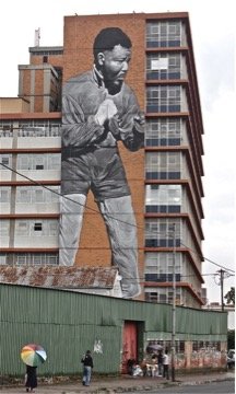 Commissioned by the Maboneng precinct in Johannesburg, South Africa, as a gift to the city in the memory of Nelson Mandela, South African artist Freddy Sam, painted this 10-story mural.