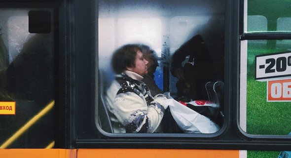 Inside the train, shoulders are wedged among shoulders and bodies breathe the same sticky air, but no eyes make contact. 